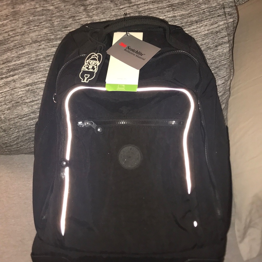Kipling rolling book bag.